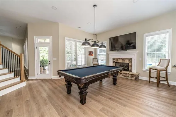 a kitchen with a sink cabinets and wooden floor