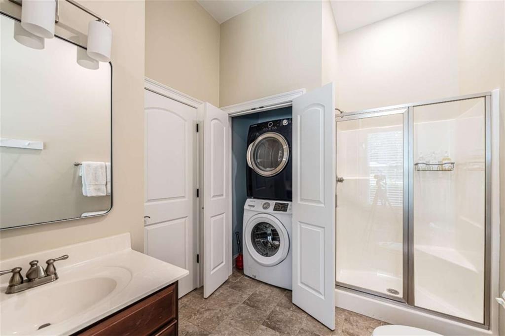 138 Nelson Boulevard Northwest Rome, GA 30165 - Photo 35 of 39 a bathroom with a sink a washer and dryer