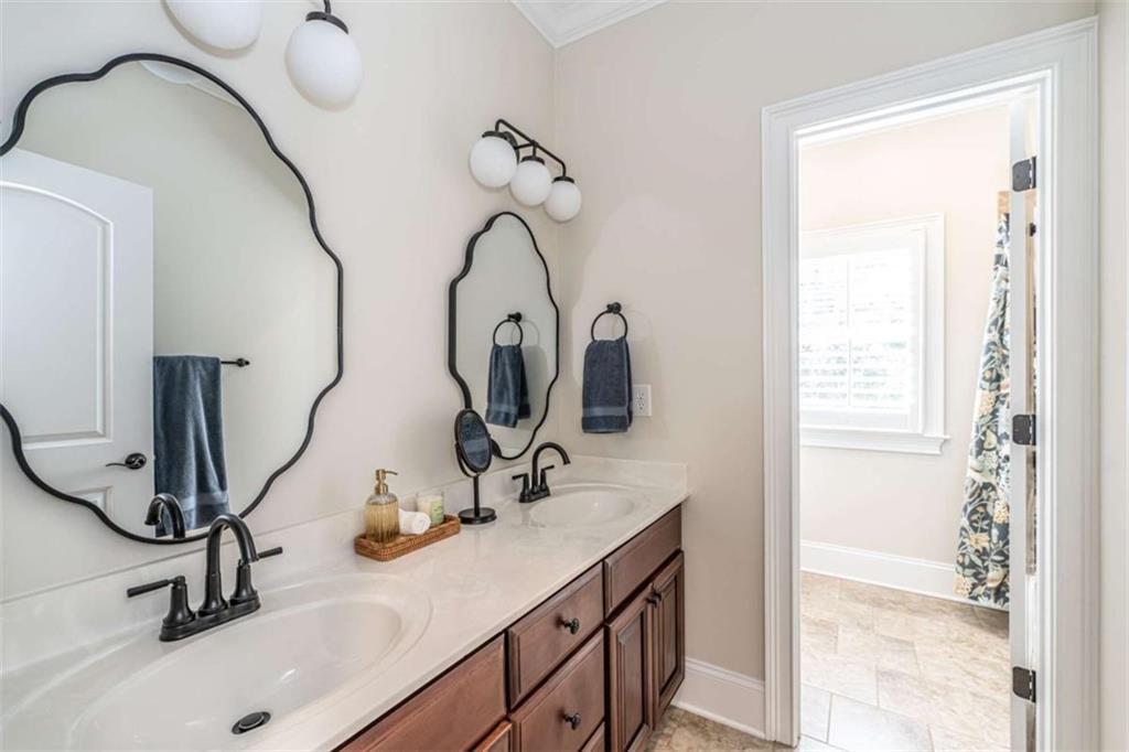 138 Nelson Boulevard Northwest Rome, GA 30165 - Photo 37 of 39 a bathroom with a sink and a mirror