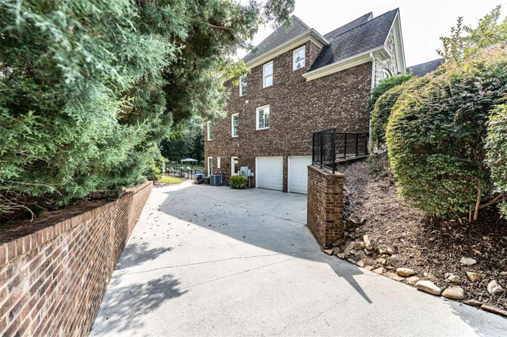 138 Nelson Boulevard Northwest Rome, GA 30165 - Photo 38 of 39 a view of a brick house with a yard