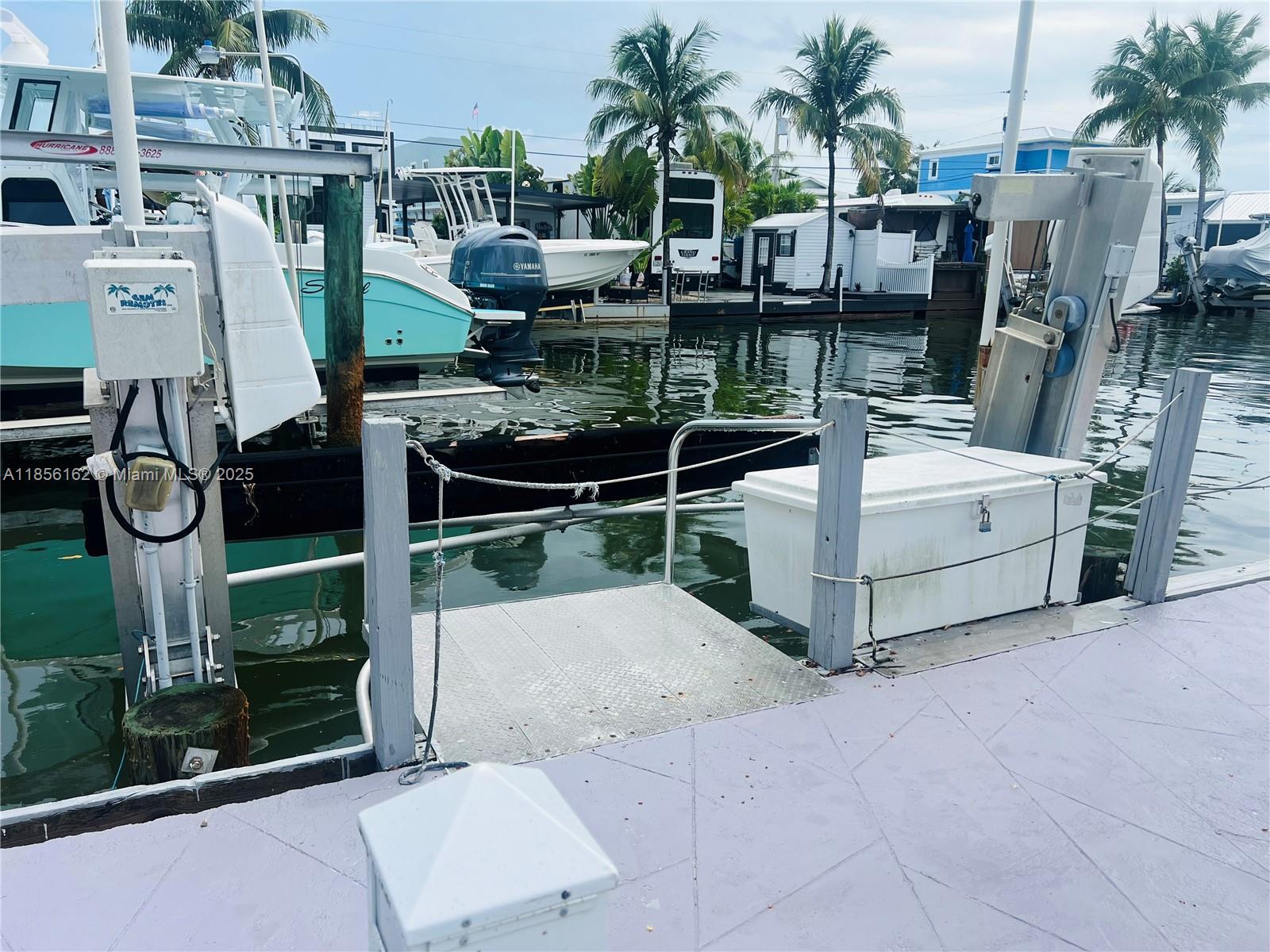 325 Calusa Street Key Largo, FL 33037 - Photo 4 of 28 43’ Dock with 15,000 lb Boat Lift