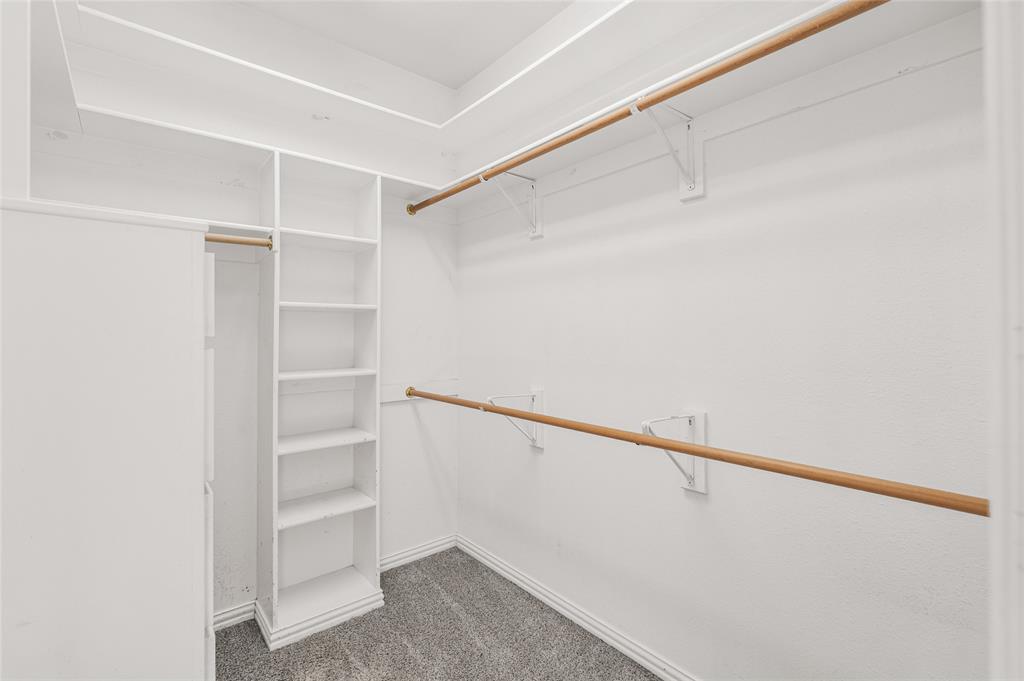 10264 Farmington Road Van Alstyne, TX 75495 - Photo 19 of 39 a view of walk in closet with empty racks