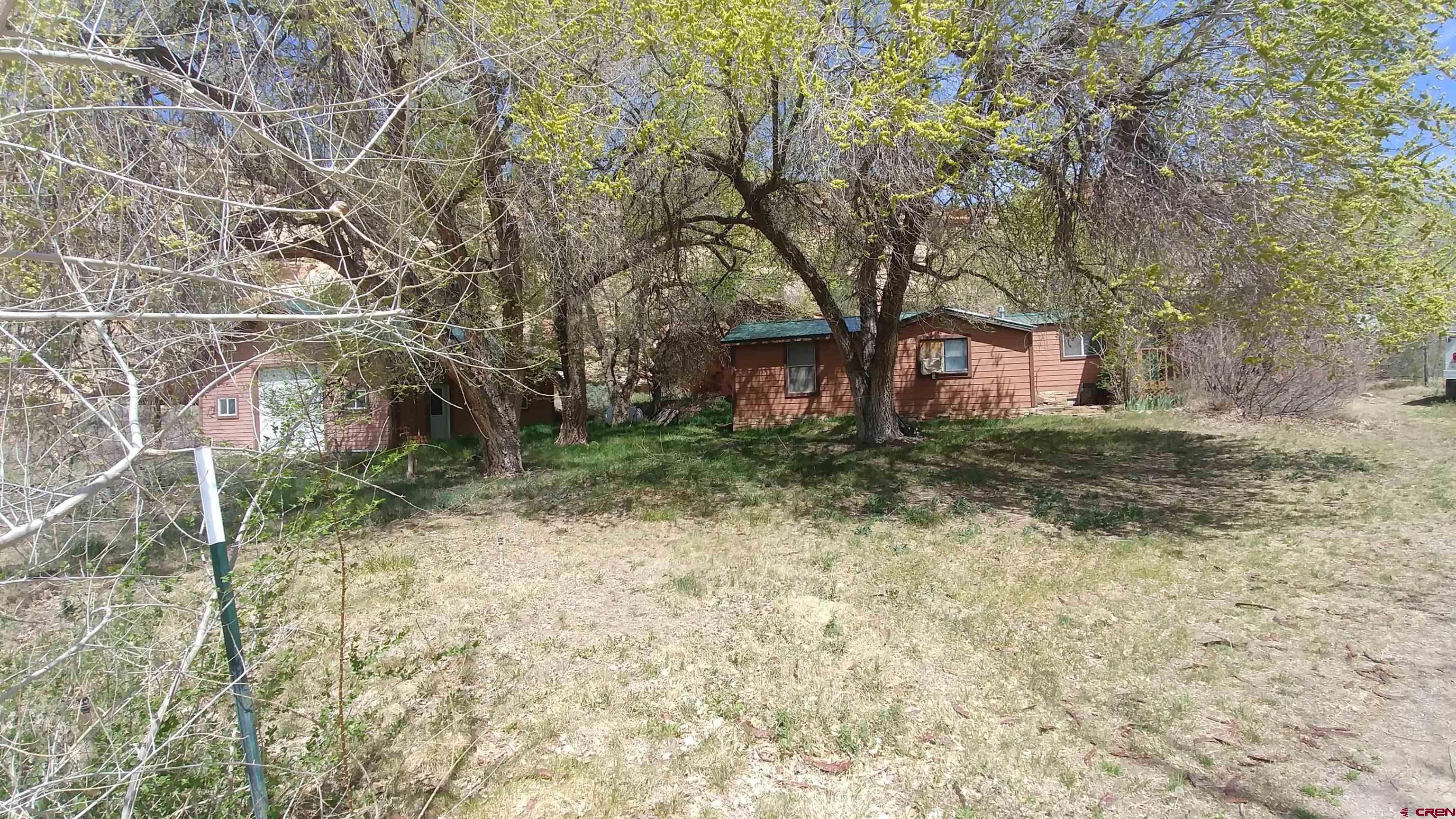 15705 Rd J Cortez, CO 81321 - Photo 5 of 34 a view of a yard with plants and trees