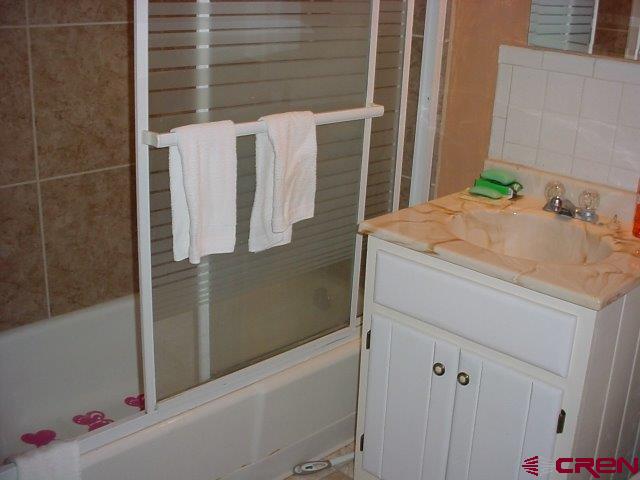 15705 Rd J Cortez, CO 81321 - Photo 8 of 34 a bathroom with a sink and mirror