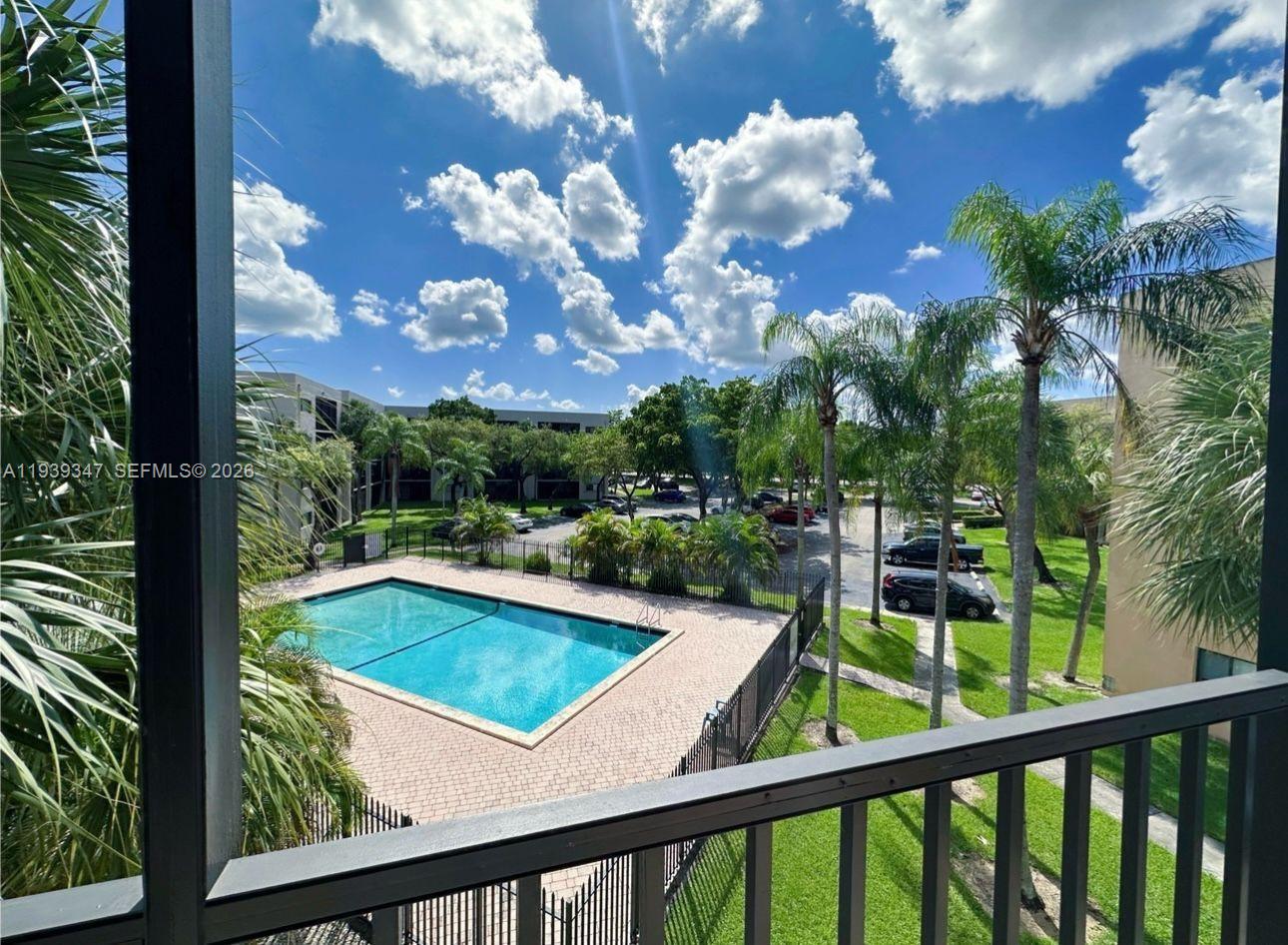 a view of swimming pool from a balcony
