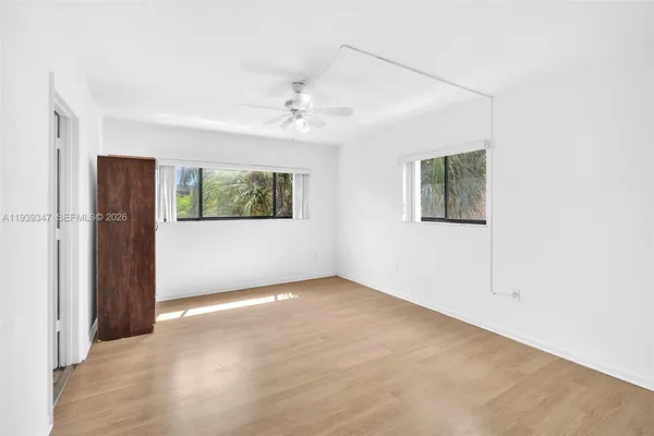 a view of an empty room with a window