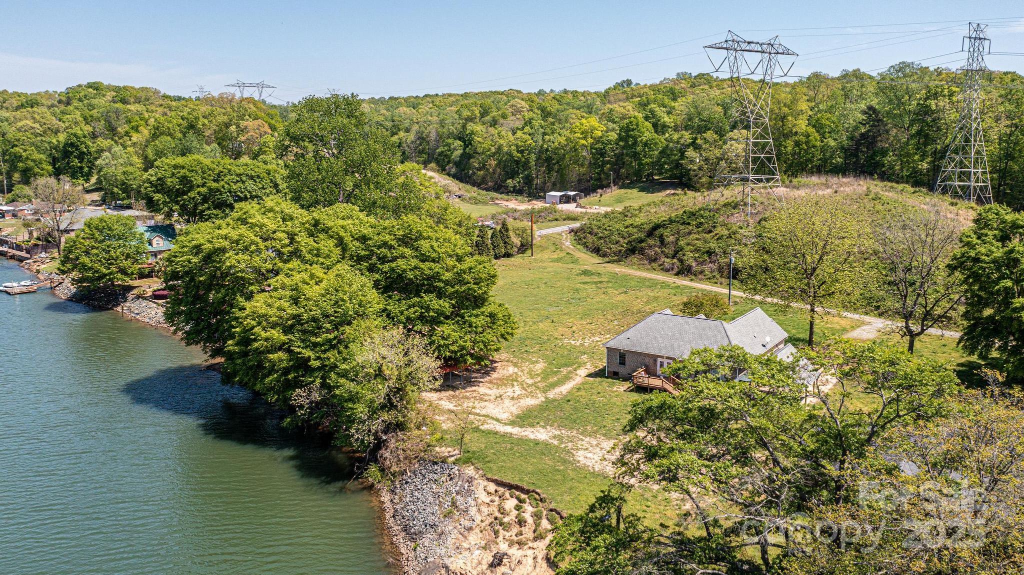 1408 Hart Road Charlotte, NC 28214 - Photo 5 of 7 a view of a lake with a yard