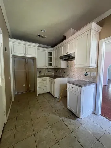 a kitchen with stainless steel appliances granite countertop a refrigerator sink and cabinets