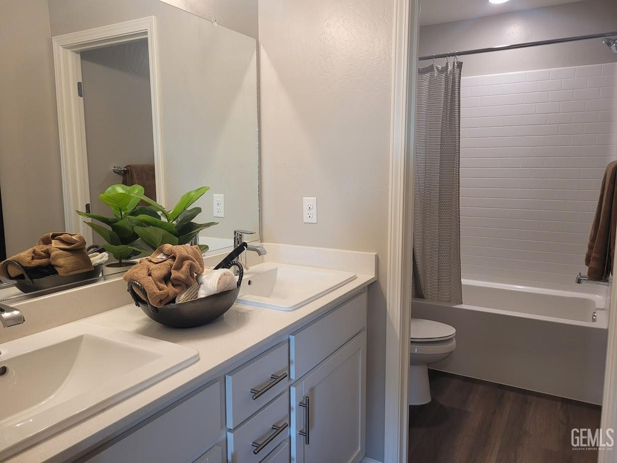 Undisclosed Address Bakersfield, CA 93313 - Photo 20 of 25 a bathroom with a sink a toilet and shower