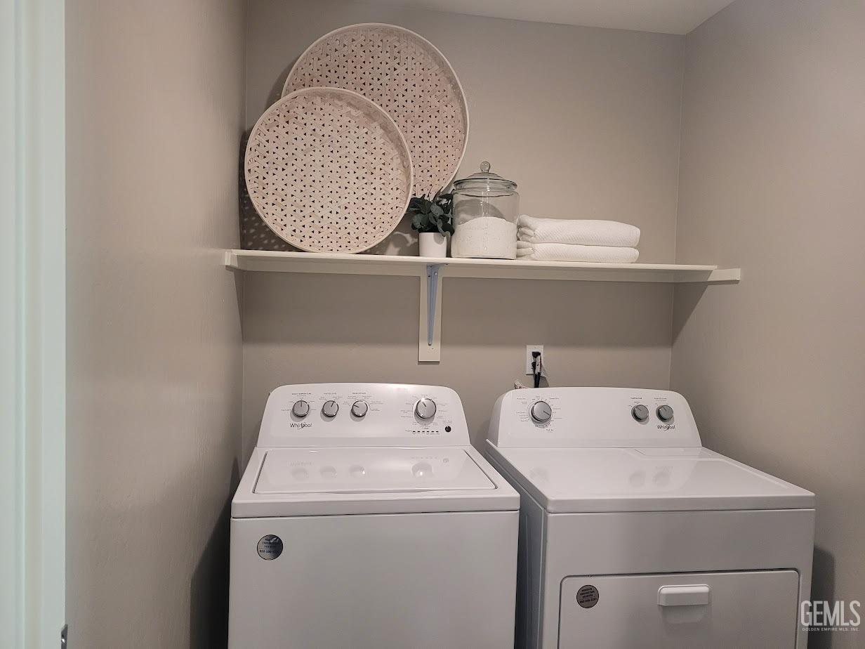 Undisclosed Address Bakersfield, CA 93313 - Photo 22 of 25 a utility room with dryer and washer