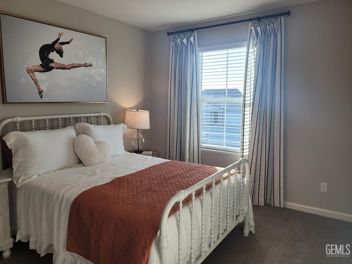 Undisclosed Address Bakersfield, CA 93313 - Photo 23 of 25 a bed sitting in a bedroom next to a window