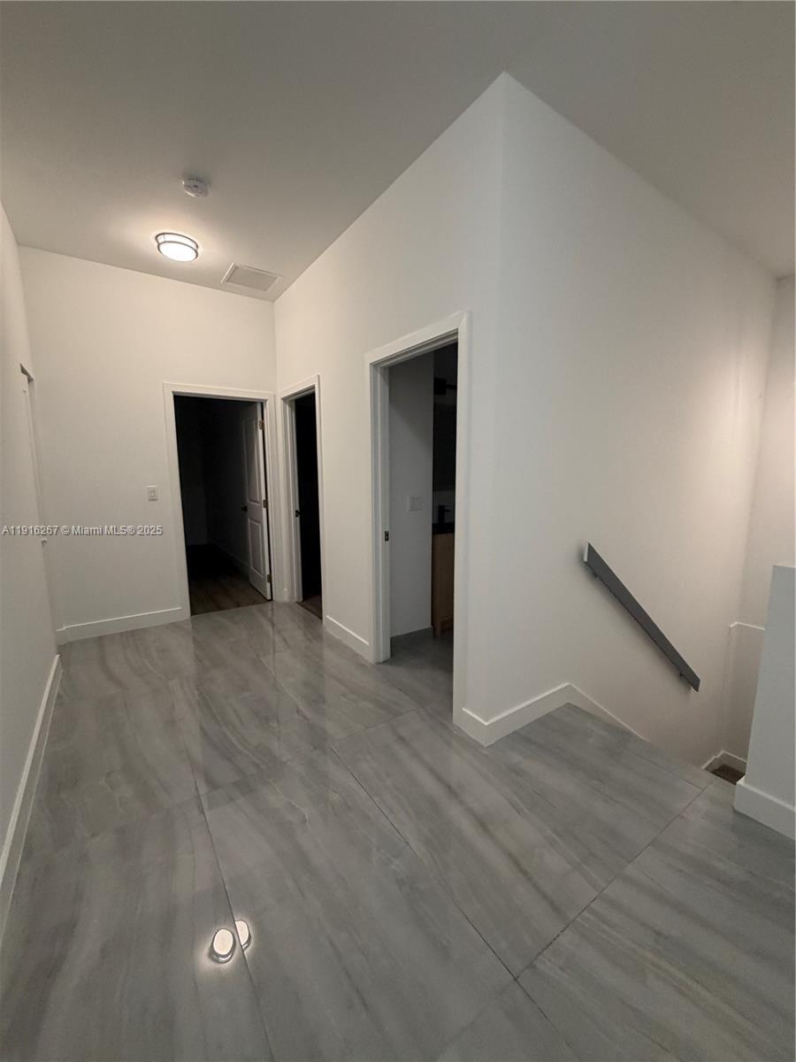 932 Southwest 10th Street, Unit 3 Hallandale Beach, FL 33009 - Photo 11 of 22 a view of an empty room