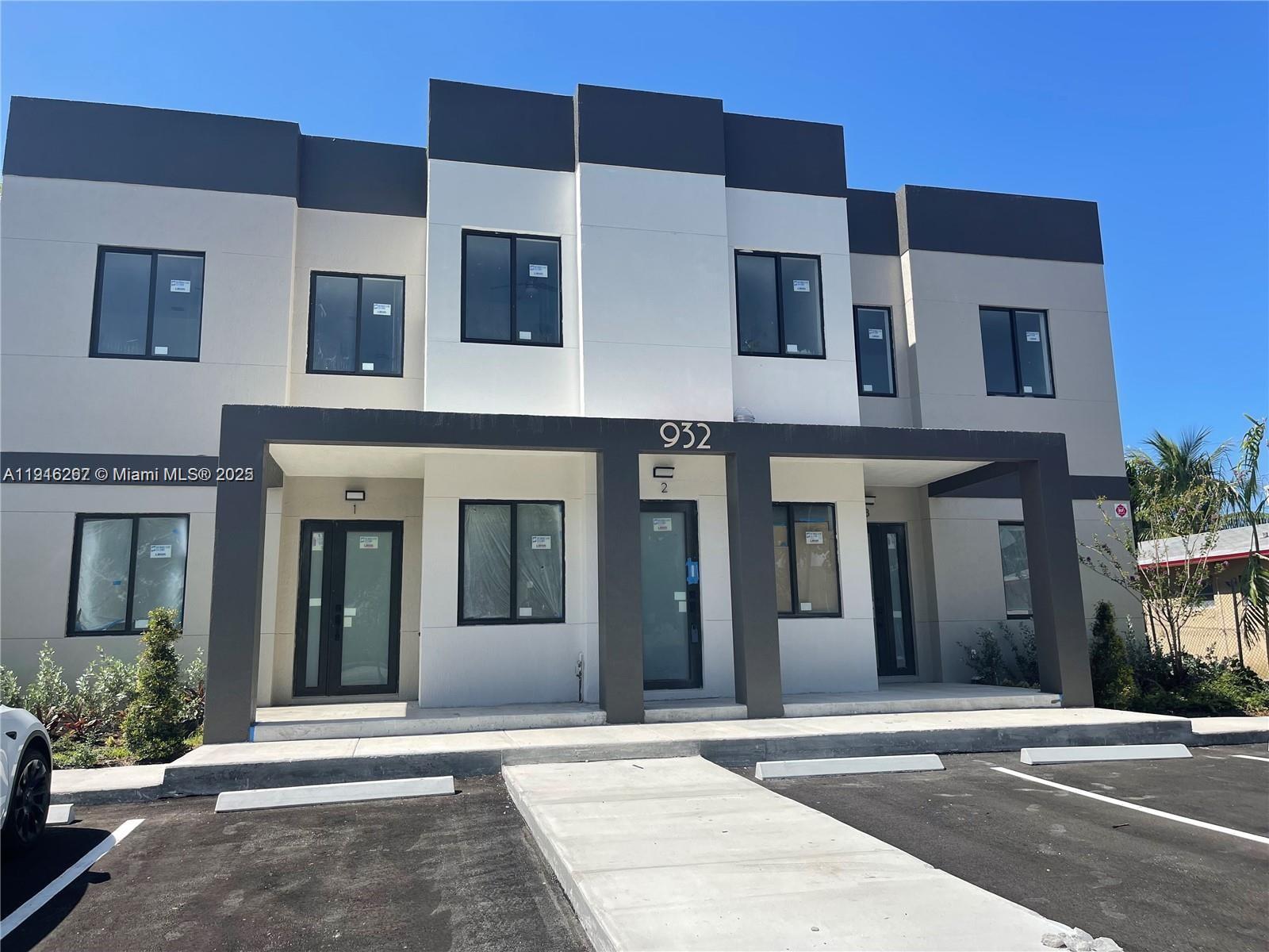 932 Southwest 10th Street, Unit 3 Hallandale Beach, FL 33009 - Photo 2 of 22 a view of a building with a street