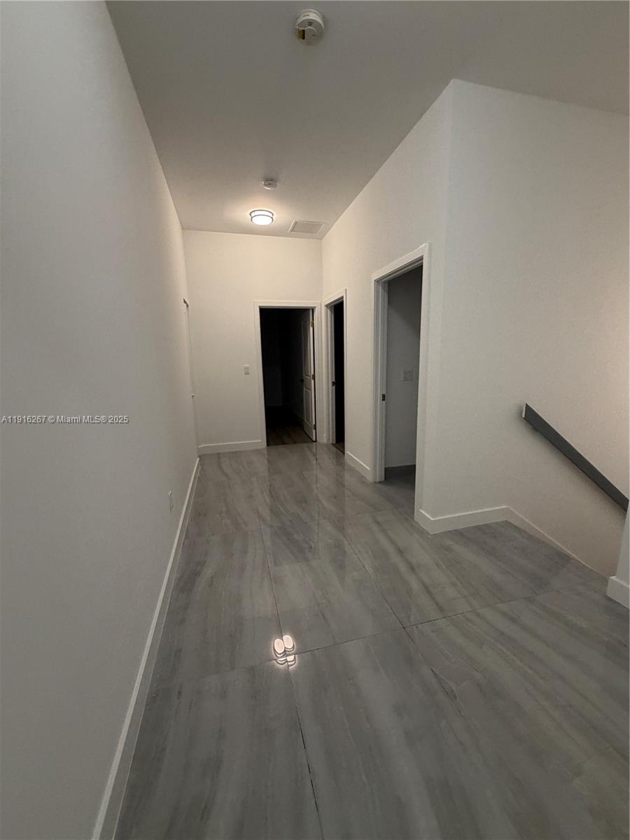 932 Southwest 10th Street, Unit 3 Hallandale Beach, FL 33009 - Photo 10 of 22 a view of an empty room