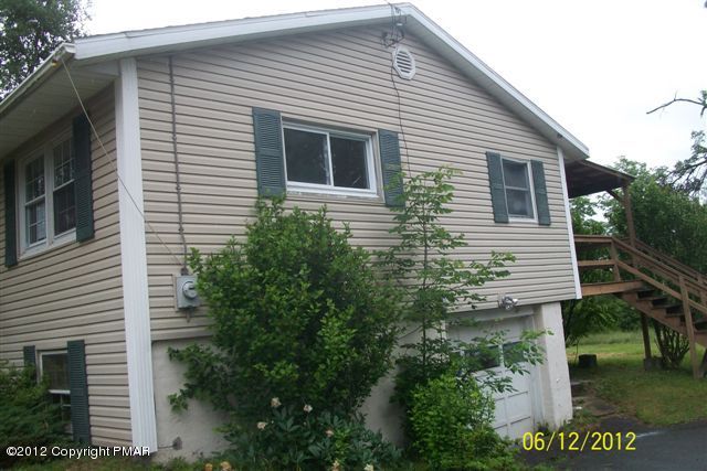 22 Pump House Road Lake Ariel, PA 18436 - Photo 3 of 18 a view of a house with a yard and potted plants