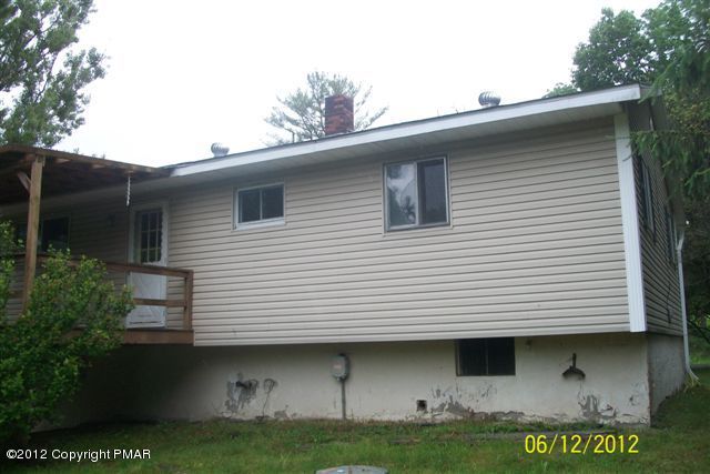 22 Pump House Road Lake Ariel, PA 18436 - Photo 4 of 18 a front view of a house with garden