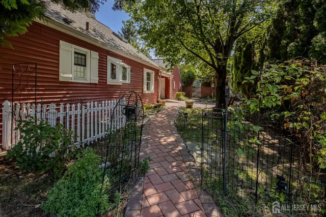 a view of a house with a tree