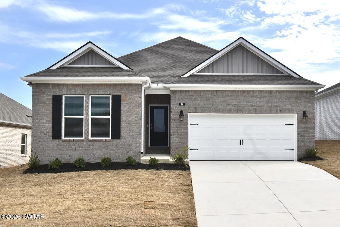 44 Clarendon Cove Jackson, TN 38305 - Photo 1 of 17 a front view of a house with a yard