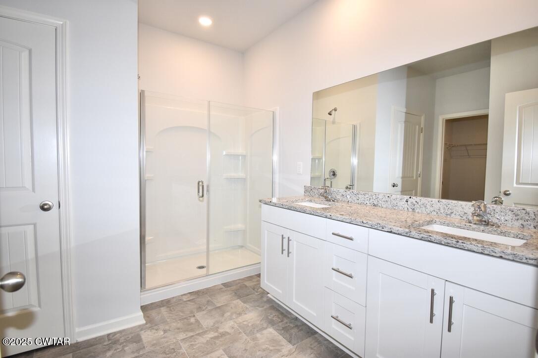 44 Clarendon Cove Jackson, TN 38305 - Photo 11 of 17 a bathroom with a granite countertop sink mirror and double