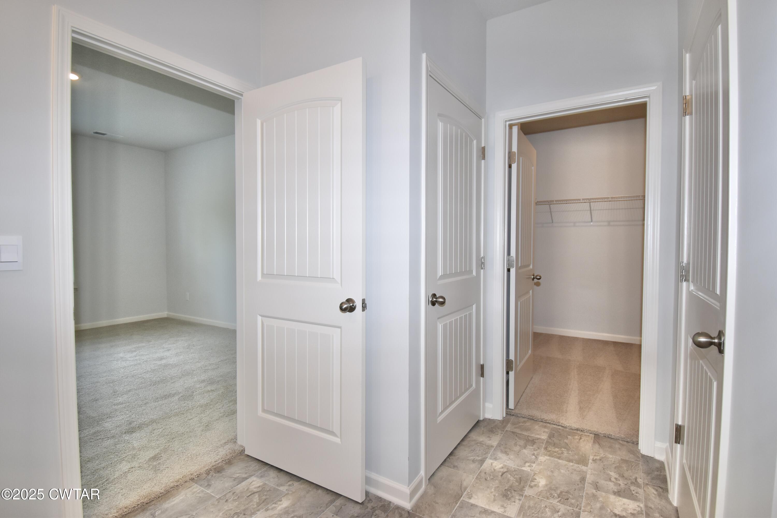 44 Clarendon Cove Jackson, TN 38305 - Photo 12 of 17 a view of an empty room with closet and mirror