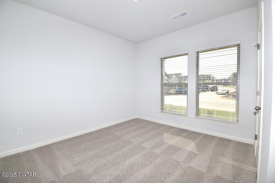 44 Clarendon Cove Jackson, TN 38305 - Photo 13 of 17 a view of an empty room with a window