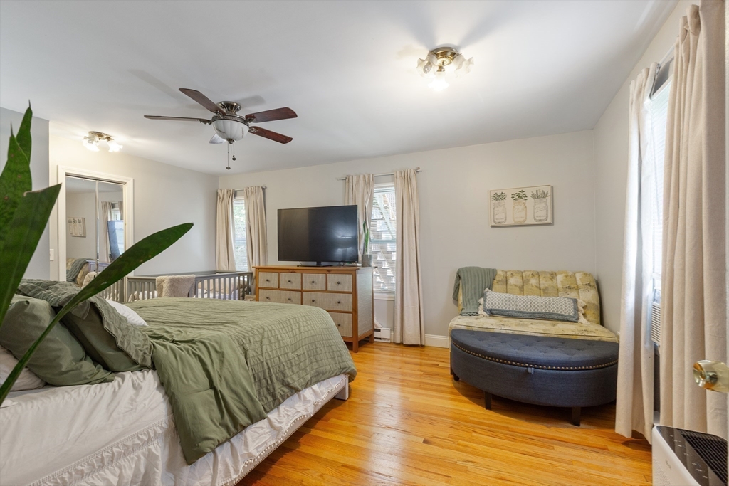 36-38 Priesing Street, Unit 2 Boston, MA 02130 - Photo 16 of 18 a bedroom with a bed and wooden floor