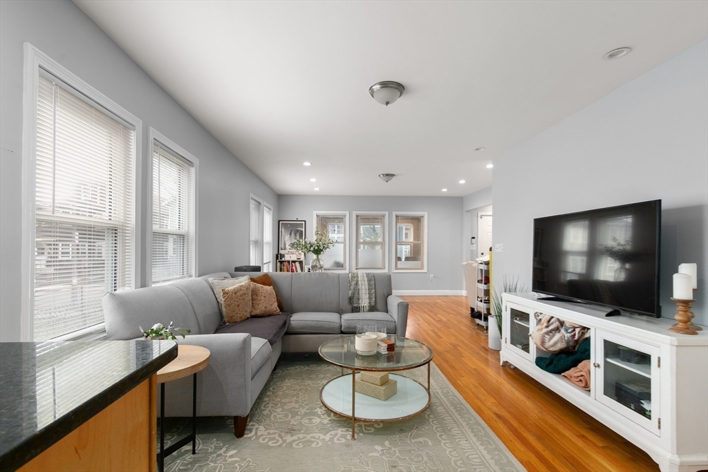 36-38 Priesing Street, Unit 2 Boston, MA 02130 - Photo 3 of 18 a living room with furniture and a flat screen tv