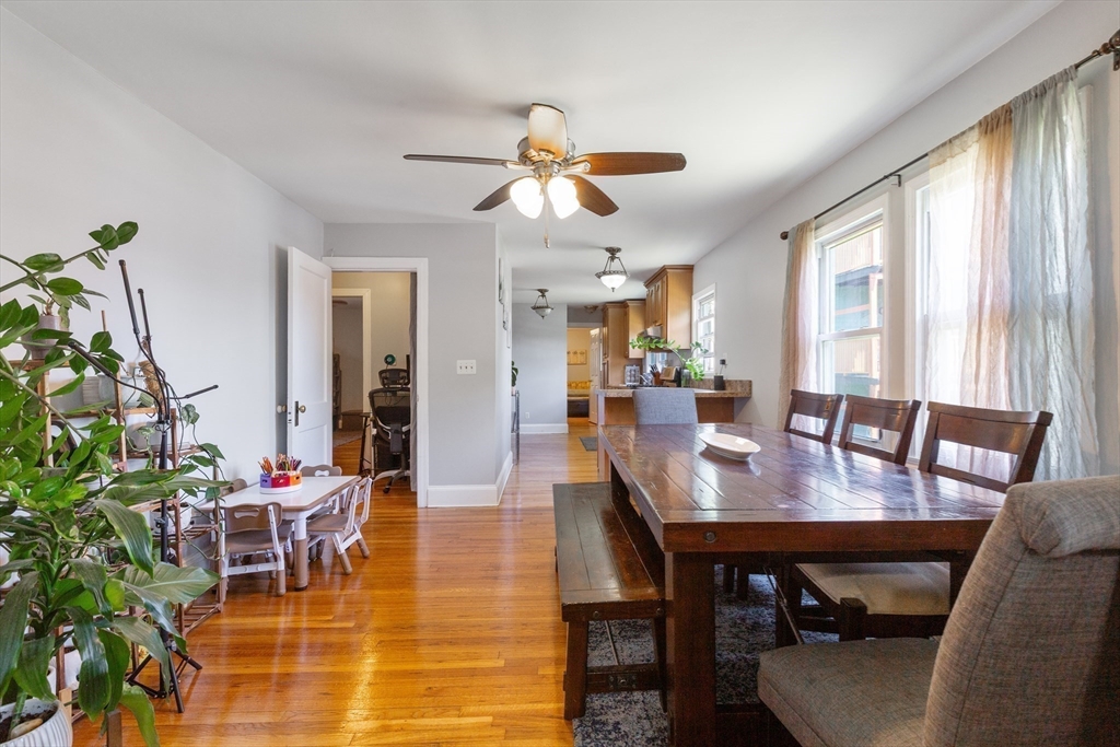 36-38 Priesing Street, Unit 2 Boston, MA 02130 - Photo 4 of 18 a dining room with furniture a chandelier and wooden floor