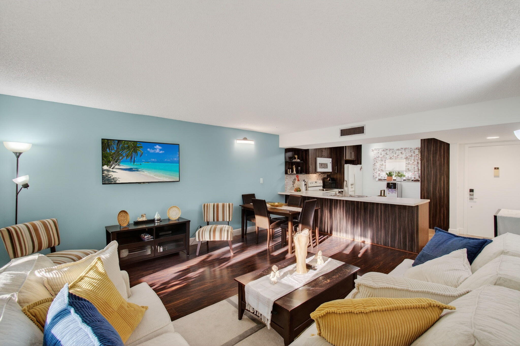 5220 Las Verdes Circle, Unit 322 Delray Beach, FL 33484 - Photo 15 of 65 a living room with furniture and a wooden floor