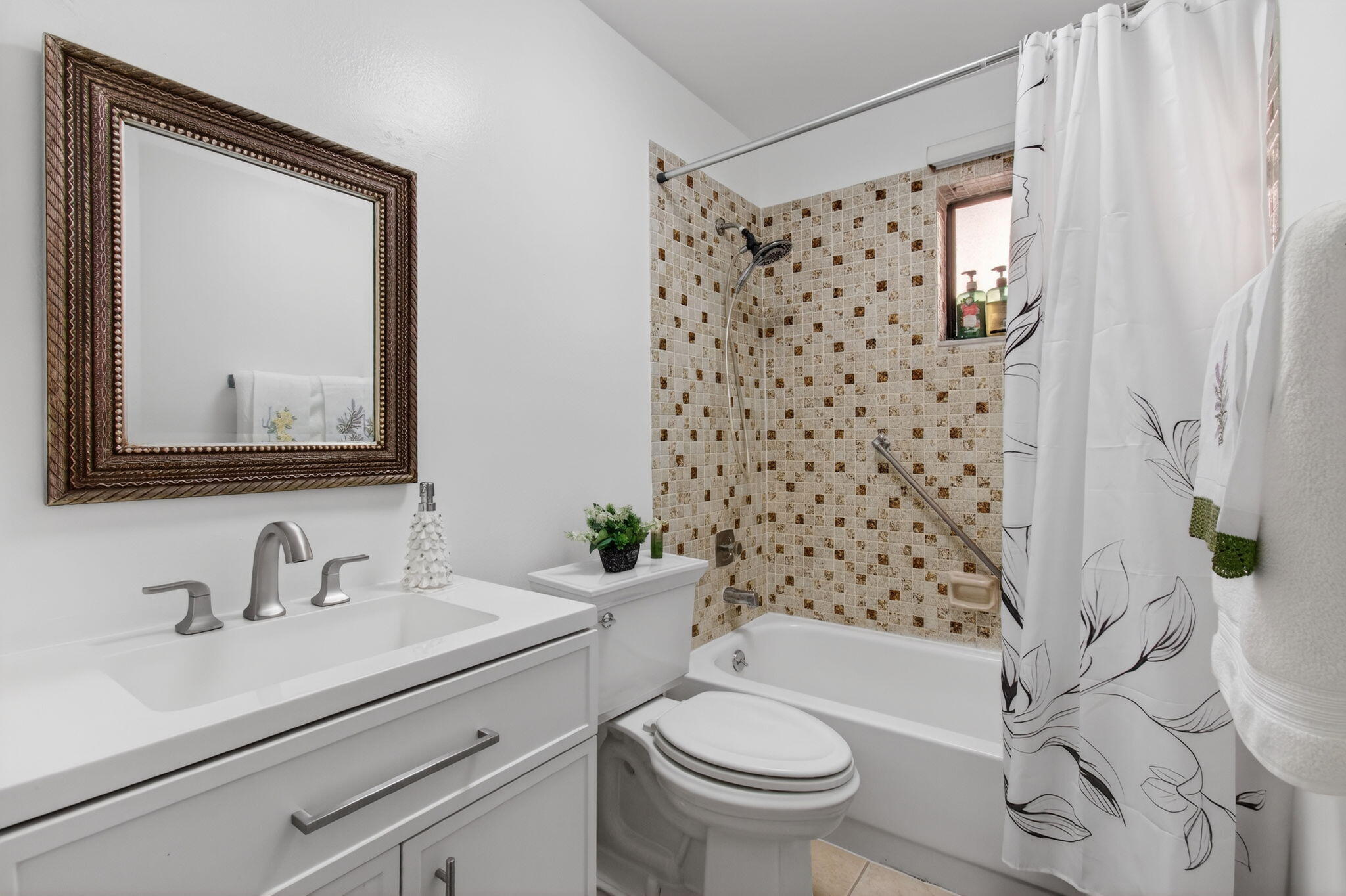 5220 Las Verdes Circle, Unit 322 Delray Beach, FL 33484 - Photo 26 of 65 a bathroom with a sink toilet and shower