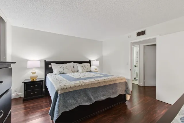 a view of a park with large trees