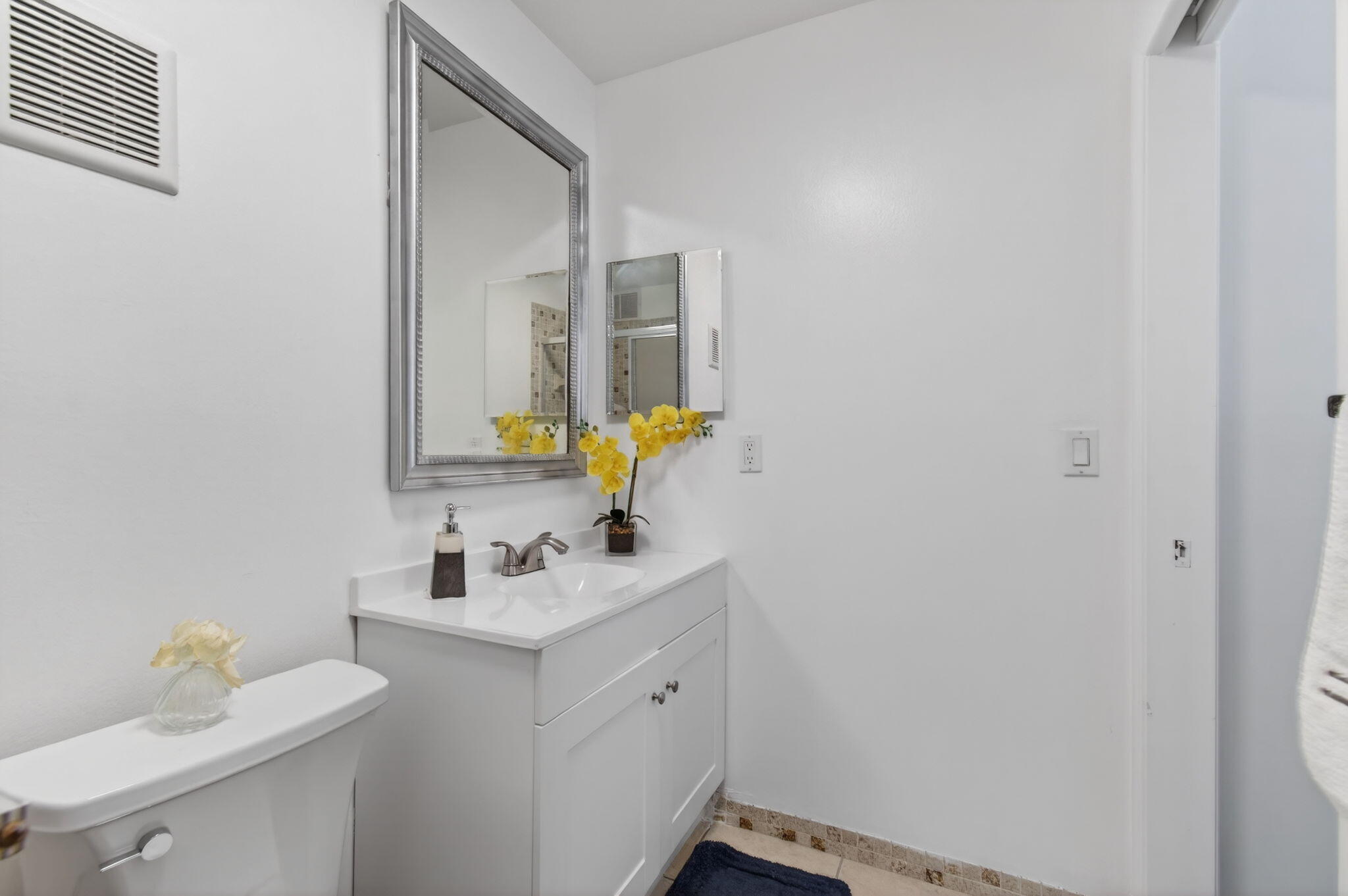 5220 Las Verdes Circle, Unit 322 Delray Beach, FL 33484 - Photo 34 of 65 a bathroom with a sink vanity and a mirror