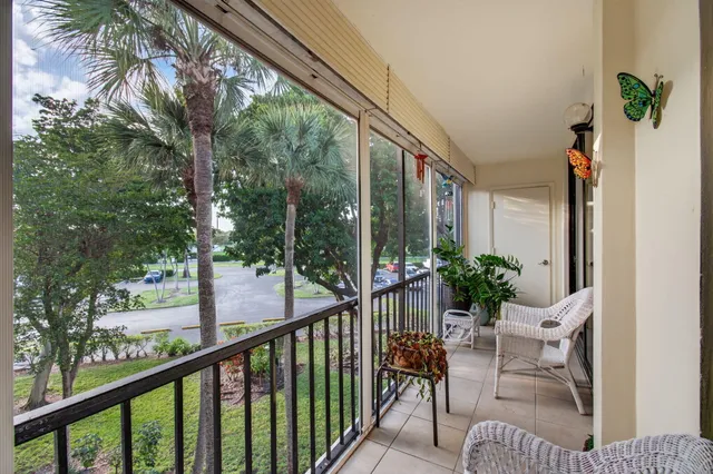an aerial view of multiple houses with yard