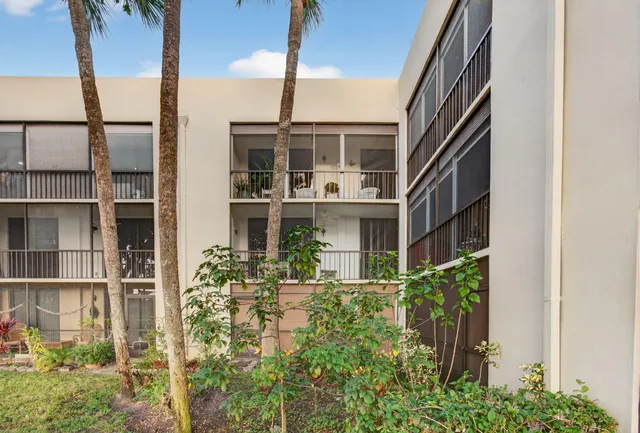 a room with furniture pool table and wooden floor