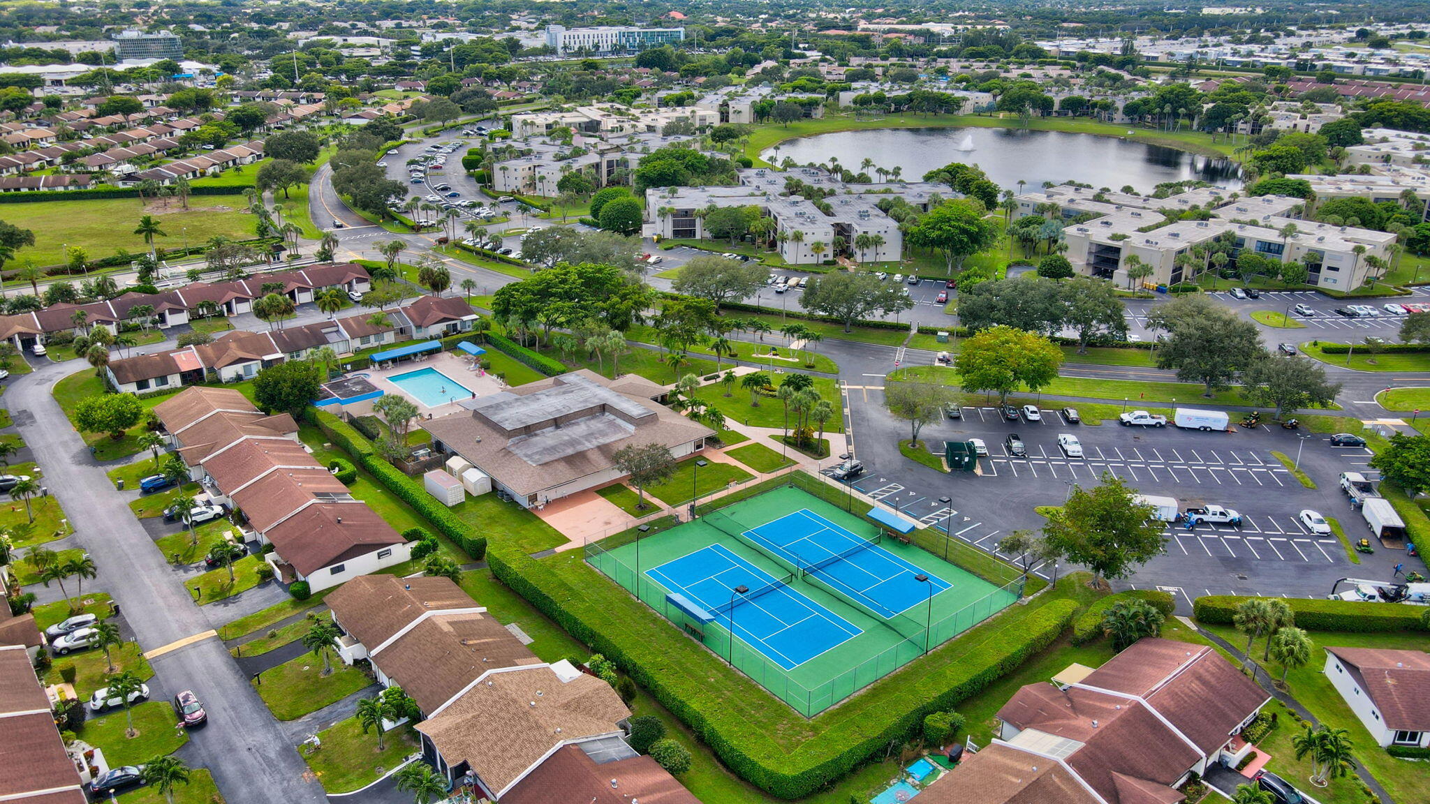 5220 Las Verdes Circle, Unit 322 Delray Beach, FL 33484 - Photo 44 of 65 an aerial view of tennis court