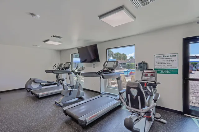 a view of a backyard with wooden fence
