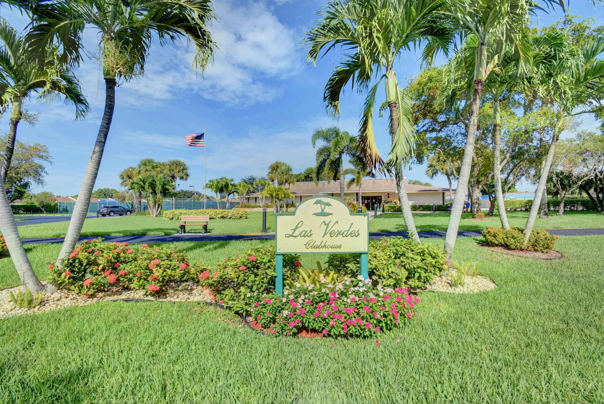 5220 Las Verdes Circle, Unit 322 Delray Beach, FL 33484 - Photo 62 of 65 a view of a garden with a fountain