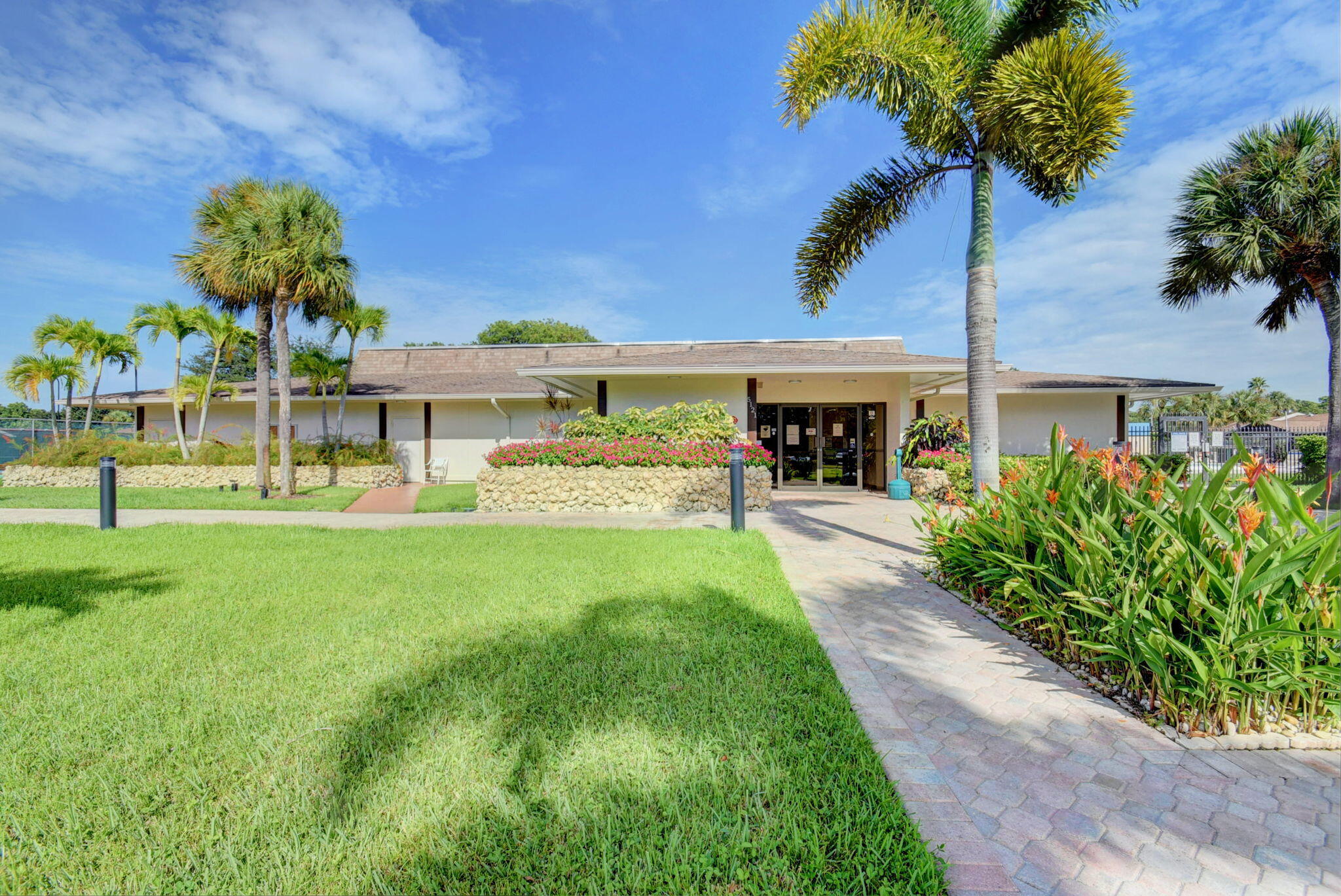 5220 Las Verdes Circle, Unit 322 Delray Beach, FL 33484 - Photo 65 of 65 a front view of a house with garden