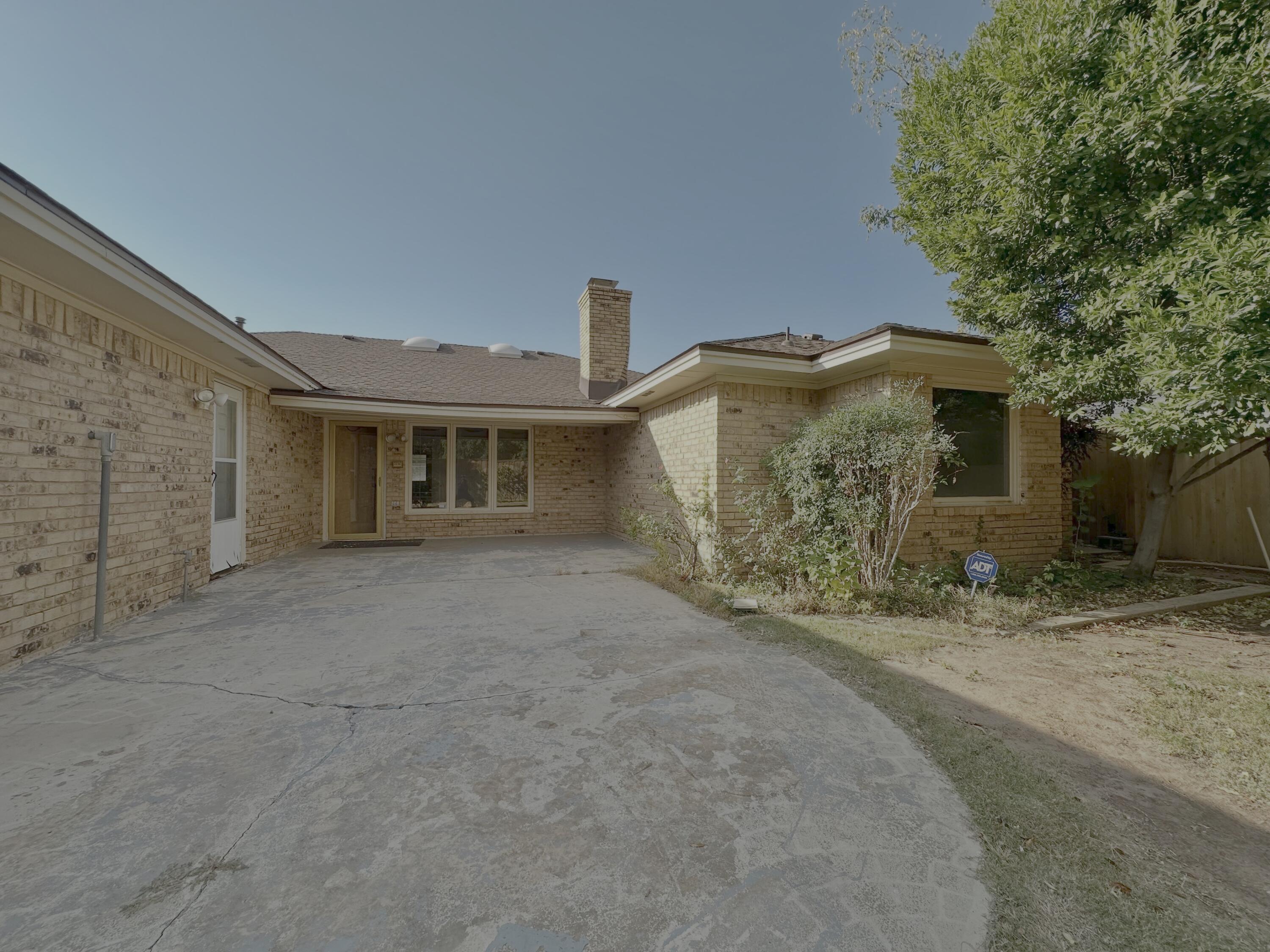 4610 88th Street Lubbock, TX 79424 - Photo 19 of 20 a front view of a house with garden