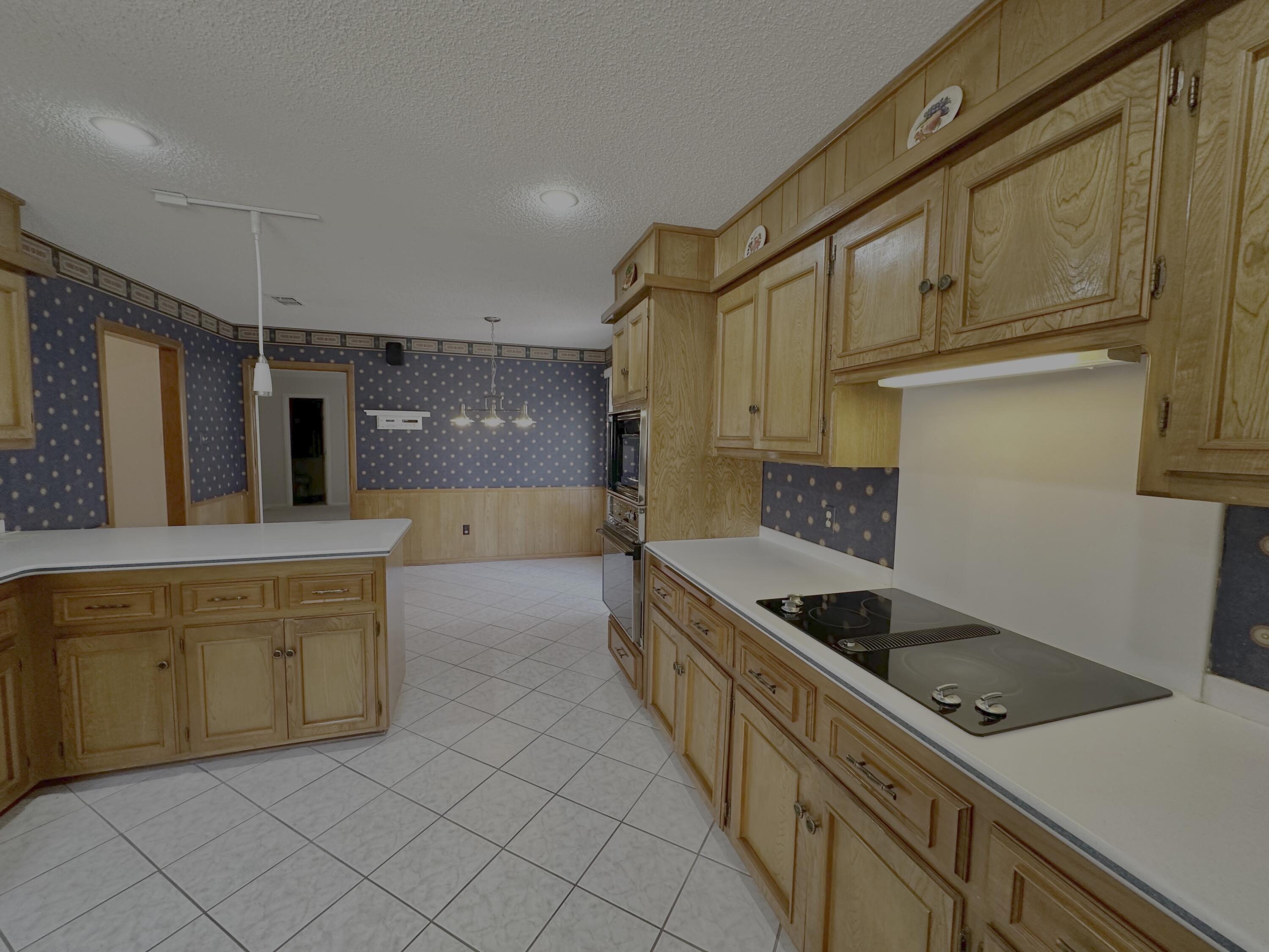 4610 88th Street Lubbock, TX 79424 - Photo 6 of 20 a kitchen with stainless steel appliances a sink and a refrigerator