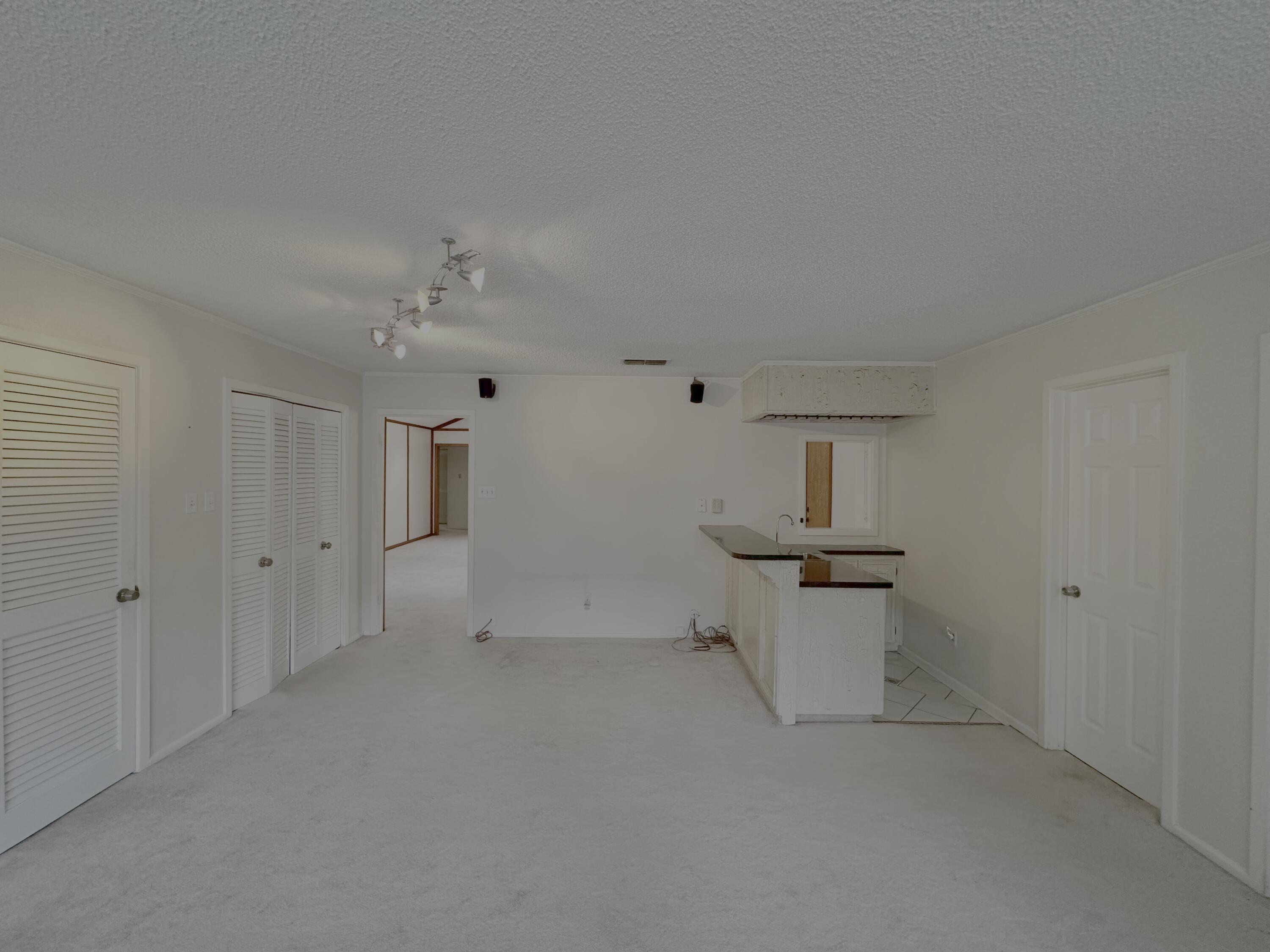 4610 88th Street Lubbock, TX 79424 - Photo 8 of 20 a view of a kitchen with a sink and a refrigerator
