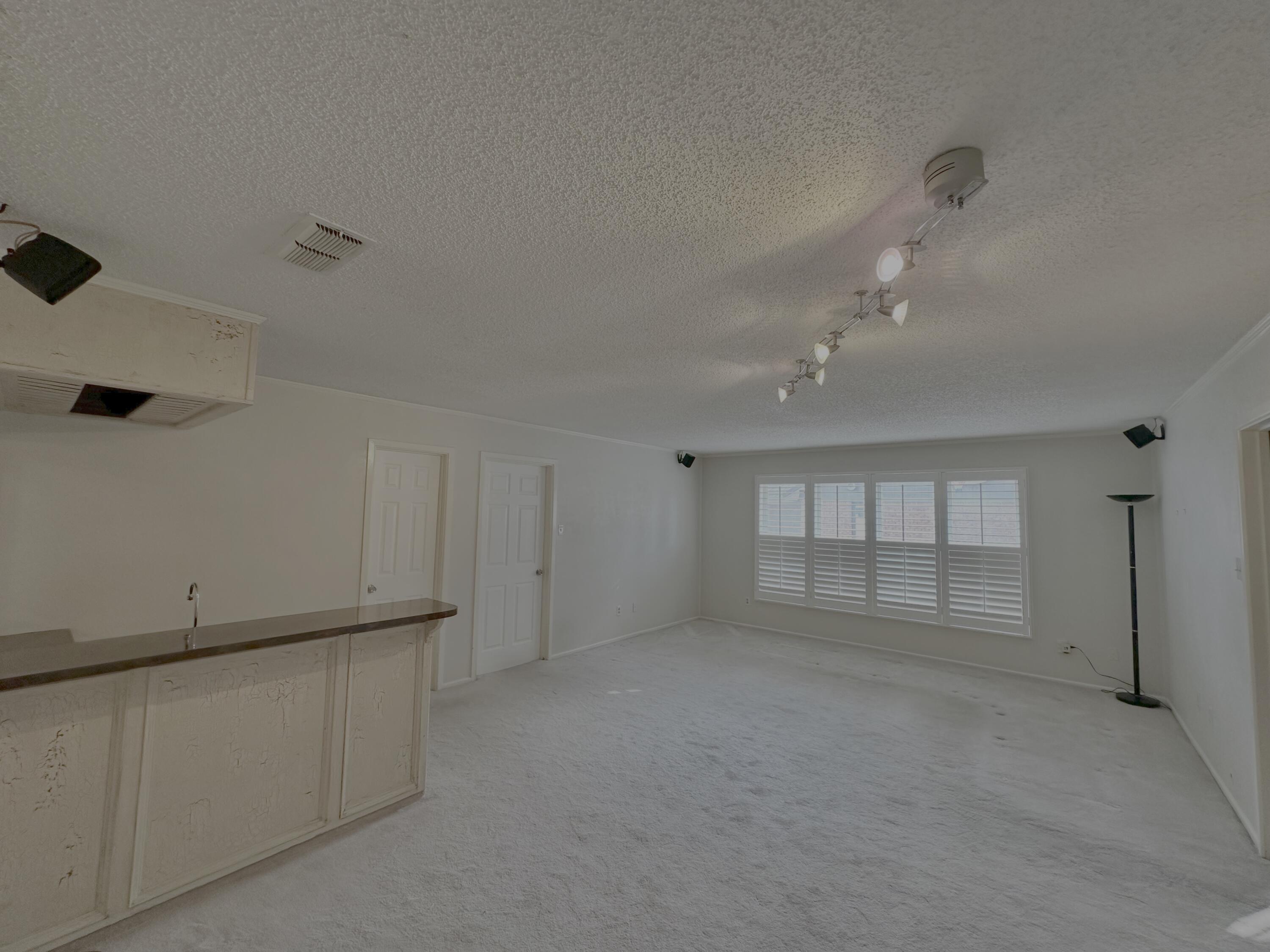 4610 88th Street Lubbock, TX 79424 - Photo 9 of 20 a view of an empty room with a window