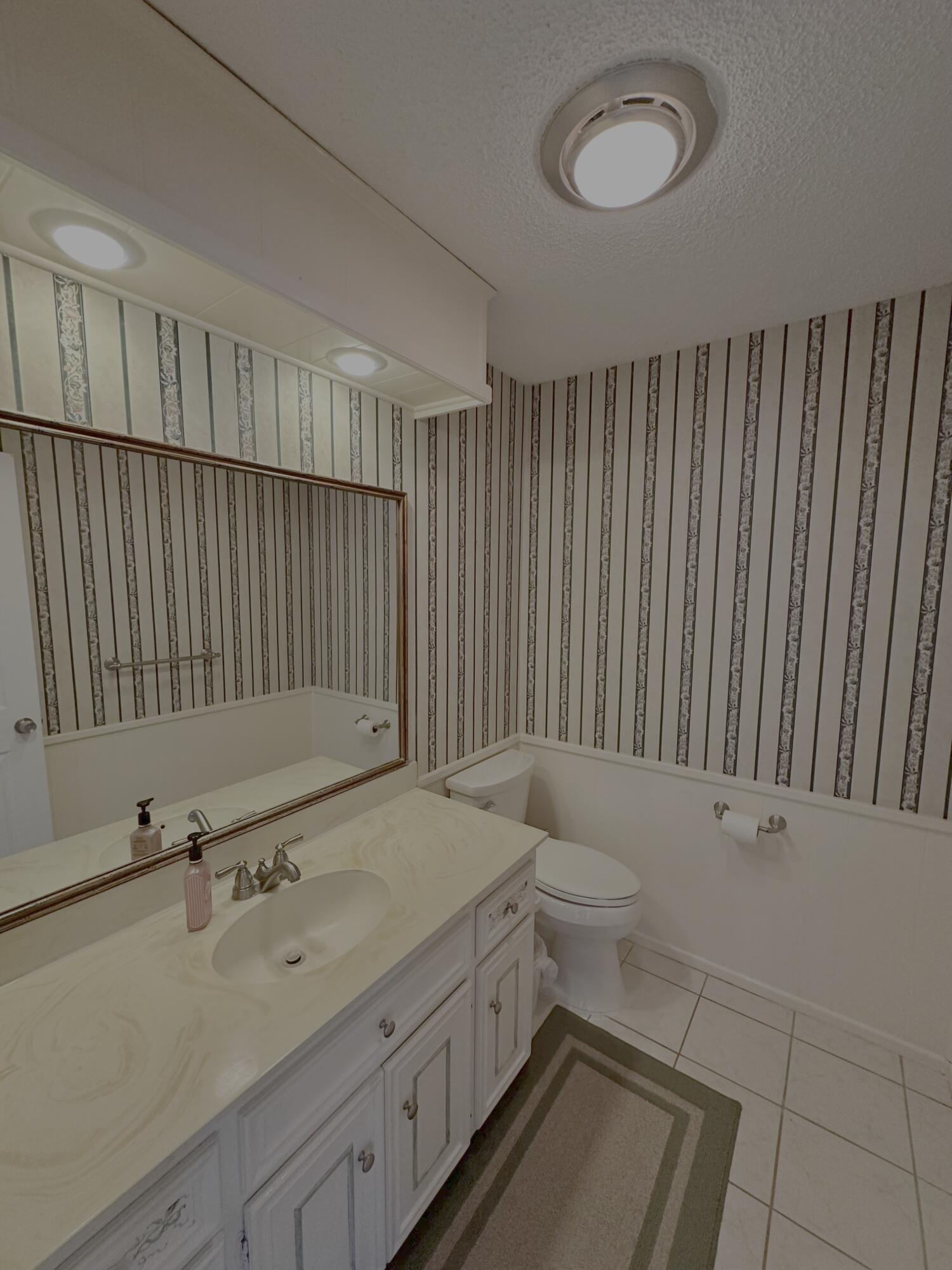 4610 88th Street Lubbock, TX 79424 - Photo 10 of 20 a bathroom with a sink and a toilet
