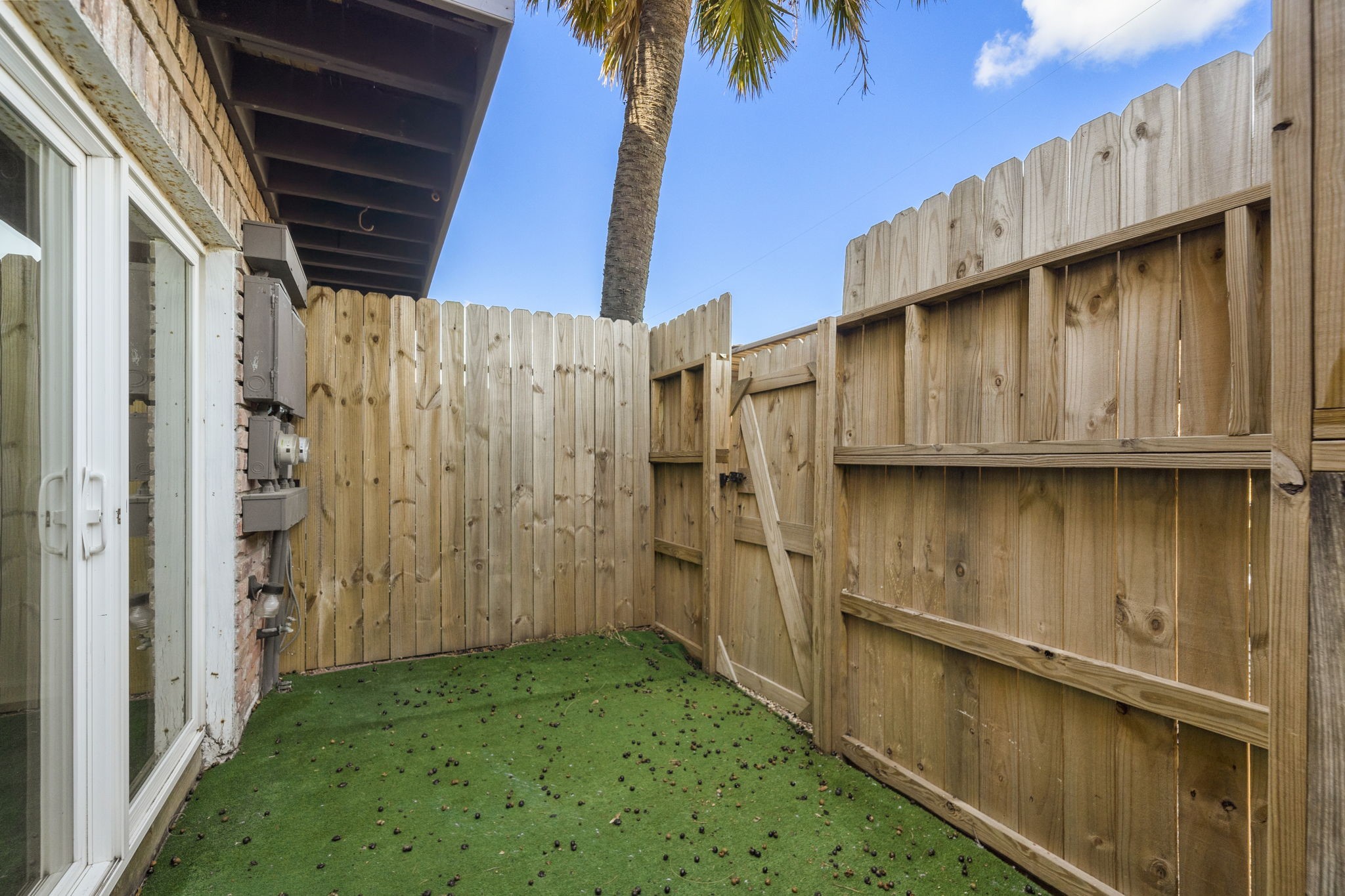 711 Holiday Drive, Unit 42 Galveston, TX 77550 - Photo 13 of 13 a view of a back yard of the house