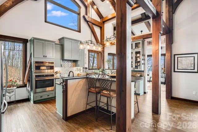 a kitchen with stainless steel appliances granite countertop a sink and stove