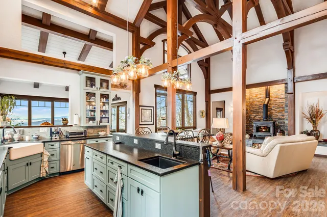 a kitchen with stainless steel appliances a sink stove and cabinets