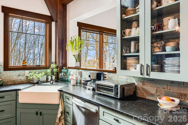 a view of a kitchen and dining table