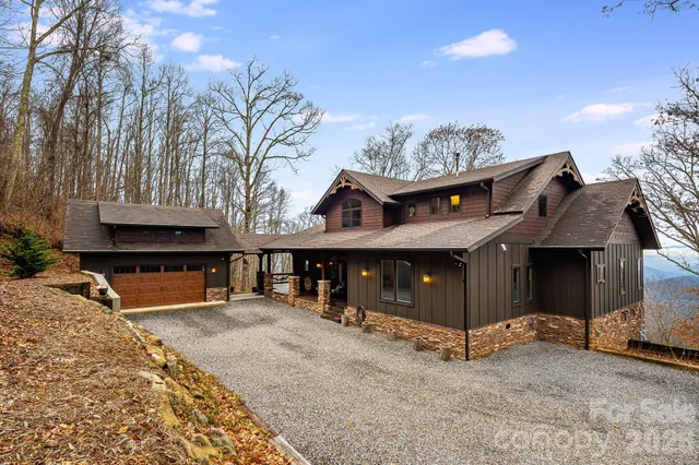 a view of a house with a snow in the background