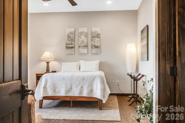 a backyard of a house with barbeque oven and plants
