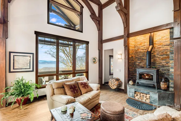 a living room with furniture and a floor to ceiling window